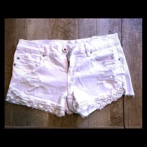 Indigo Rein white lace hem jean shorts